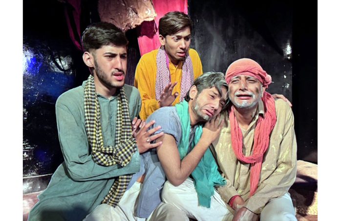 A scene from the play 'Kafan' being staged in Jammu on Sunday.