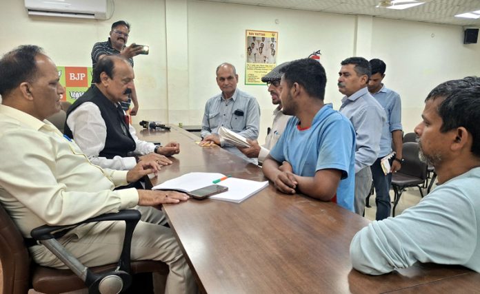 BJP MLAs, Surjit Singh Slathia and Prof Gharu Ram Bhagat at a public darbar at Jammu on Tuesday. BJP MLAs, Surjit Singh Slathia and Prof Gharu Ram Bhagat at a public darbar at Jammu on Tuesday.