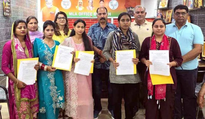 Dr Rajiv Bhagat, MLA Bishnah handing over appointment letters to AWs on Friday. Dr Rajiv Bhagat, MLA Bishnah handing over appointment letters to AWs on Friday.