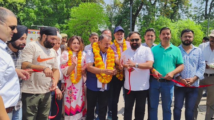 Choudhary Vikram Randhawa flagging off a development work by cutting the traditional ribbon in Gandhi Nagar area on Friday.