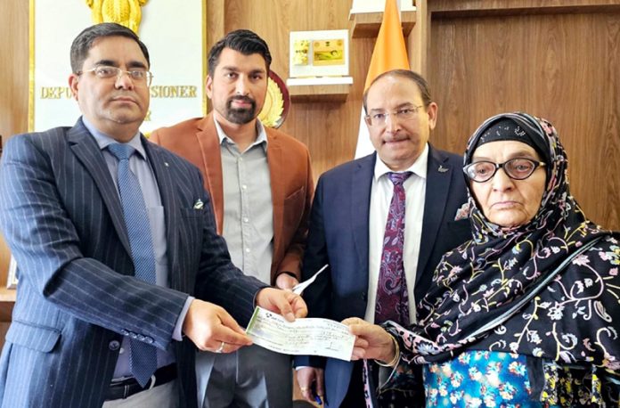 DC giving away Rs 15 lakh compensation to NoK of road accident victims at Kishtwar. DC giving away Rs 15 lakh compensation to NoK of road accident victims at Kishtwar.