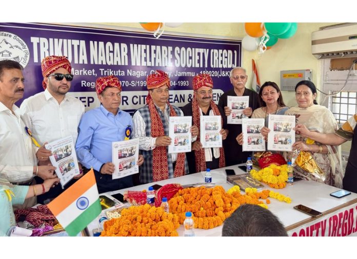 BJP President, Sat Sharma and MLA Bahu Vikram Randhawa releasing newsletter of Trikuta Nagar Welfare Society on Saturday.