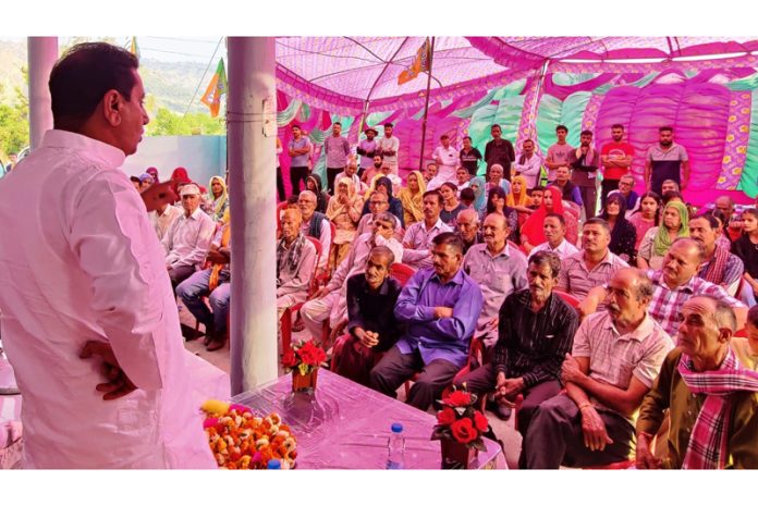 MLA Rajiv Jasrotia addressing a meeting at Jakhole on Monday.