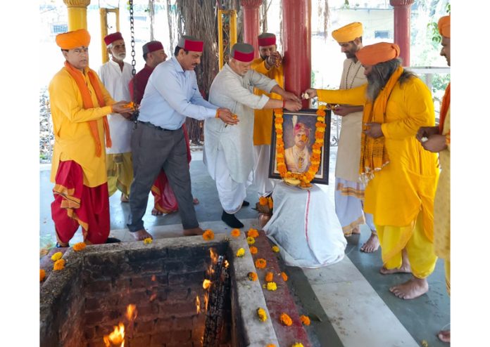 Office bearers of J&K Dharmarth Trust and others pay floral tributes to Maharaja Hari Singh Ji in Jammu on Saturday.