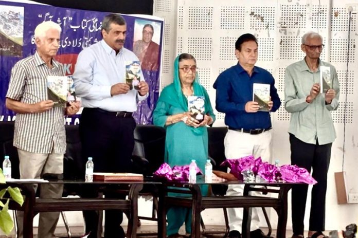 Guests releasing Dulari Pandita's book during a function in Jammu.