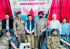 CRPF personnel donating blood during a camp in presence of DC Doda Harvinder Singh at SDH Bhaderwah.