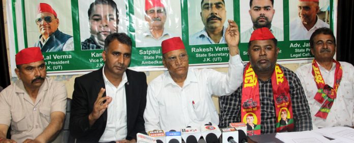 J&K president of SP, Jia Lal Verma along with others addressing a press conference at Jammu on Friday. -Excelsior/Rakesh