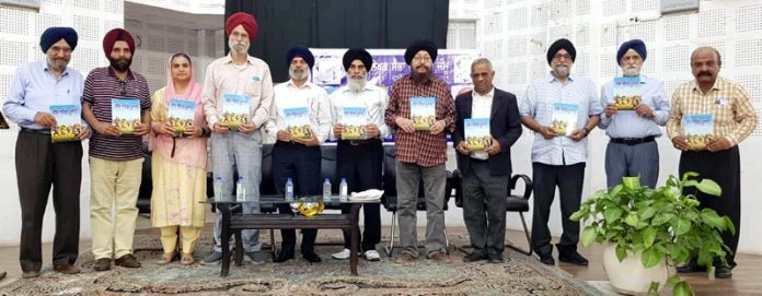 Dignitaries releasing a Punjabi book in Jammu on Friday.