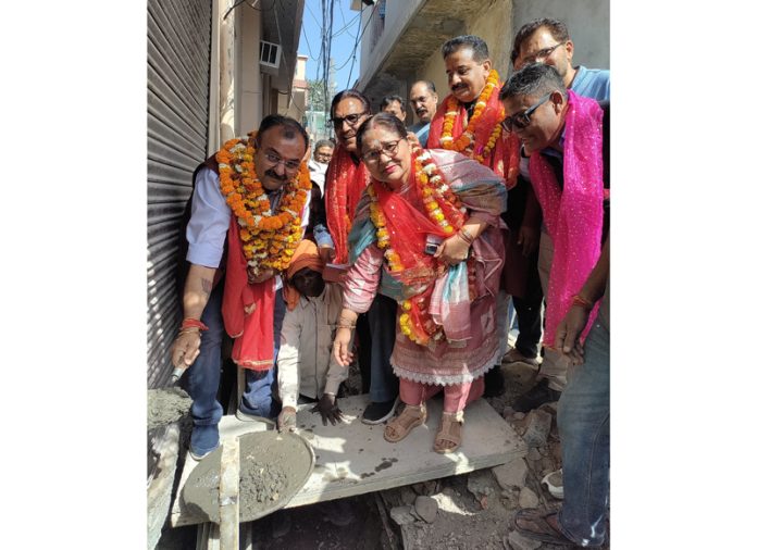 MLA Bahu Choudhary Vikram Randhawa kick starting lane and drain work at Pacca Talab on Tuesday.