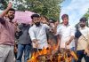 Gujjar-Bakerwal students torching effigy of BJP MLA during protest near JU campus on Friday. -Excelsior/Rakesh