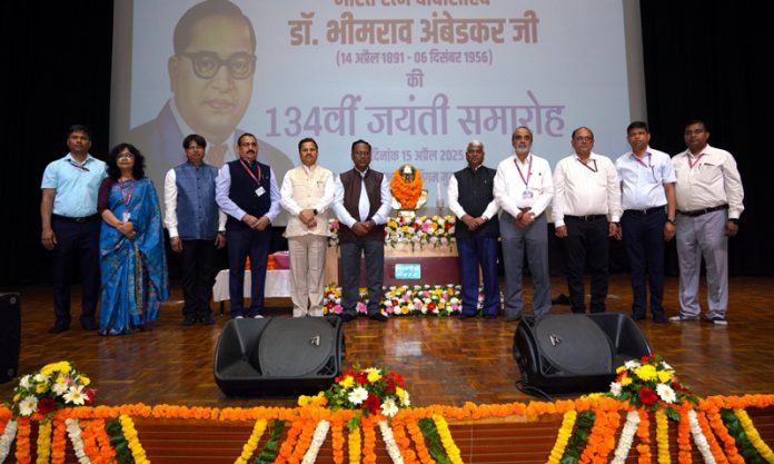 NHPC dignitaries posing for a group photograph after paying tribute to Dr. Bhimrao Ambedkar in Faridabad on Tuesday.