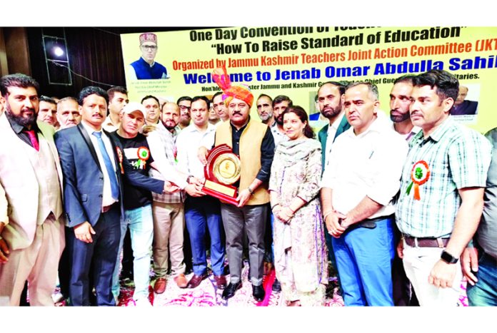 Members of JKTJAC presenting memento to DyCM Surinder Choudhary during convention on Tuesday. Members of JKTJAC presenting memento to DyCM Surinder Choudhary during convention on Tuesday.