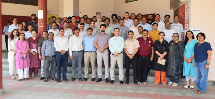 Participants with resource persons during training on `Procurement through GeM' at SMVDU.