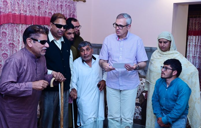 CM Omar Abdullah meeting with physically challenged people at Raabta office in Srinagar on Friday.