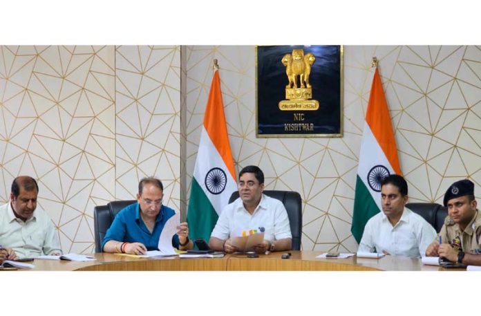 DC Kishtwar, Rajesh Kumar Shavan chairing a meeting on Tuesday.
