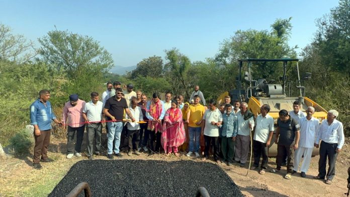 MLA Pawan Gupta inaugurating blacktopping work on Jib-Padanoo road in Udhampur.
