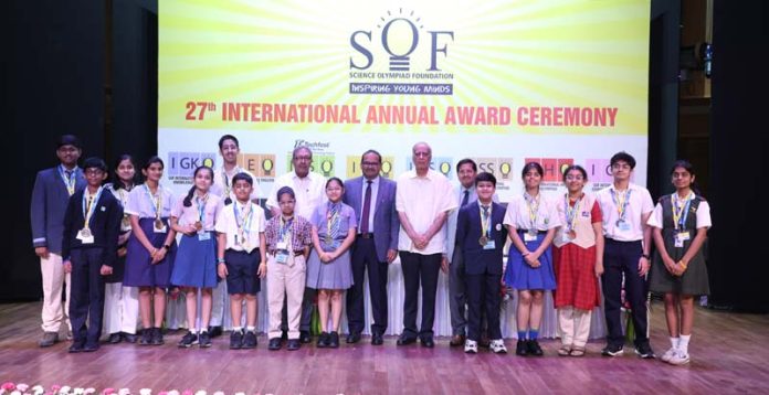 Dignitaries posing with top-ranked Science Olympiad students at felicitation ceremony. Dignitaries posing with top-ranked Science Olympiad students at felicitation ceremony.