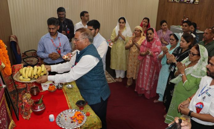 Shiksha Niketan Senior Secondary School, Jeevan Nagar management and staff performing Pooja during a programme.
