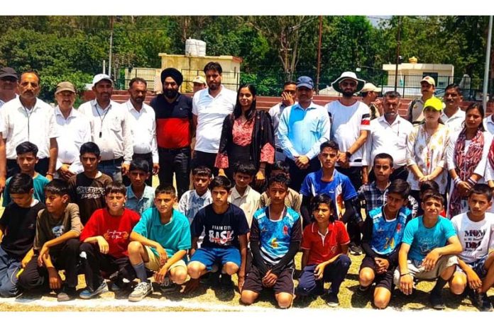 Players posing along with dignitaries during a sports meet at Reasi. Players posing along with dignitaries during a sports meet at Reasi.