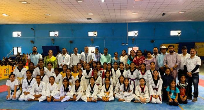 Girls posing along with dignitaries for group photograph. Girls posing along with dignitaries for group photograph.