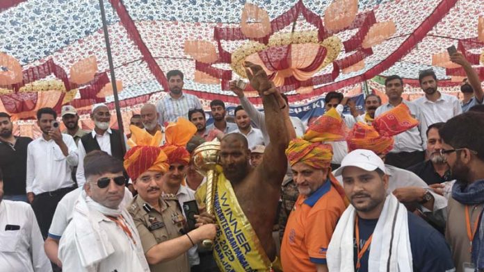 Dignitaries posing with Iranian wrestler Mohammed Mirza after his victory at Chanderkot International Dangal in Ramban. Dignitaries posing with Iranian wrestler Mohammed Mirza after his victory at Chanderkot International Dangal in Ramban.