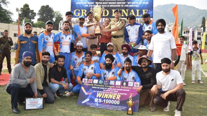 Winning team posing with trophy and dignitaries.