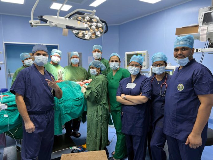 A team of doctors led by Dr Darwin Kaushal and Dr Amardeep Singh posing along with others in AIIMS Jammu. A team of doctors led by Dr Darwin Kaushal and Dr Amardeep Singh posing along with others in AIIMS Jammu.
