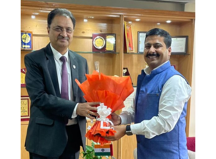 BJP spokesperson, Gaurav Gupta presenting a bouquet to MD & CEO J&K Bank, Amitava Chatterjee at Srinagar on Monday.