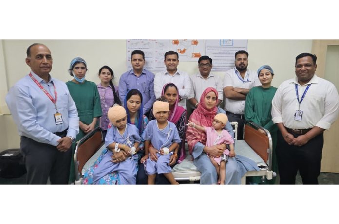 Medical team with the children, who underwent hearing implant surgeries at SMVDNSH.