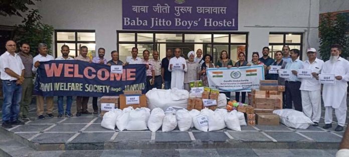 Gandhi Global Family members posing along with 2nd batch of relief for Rajouri & Poonch at Jammu. Gandhi Global Family members posing along with 2nd batch of relief for Rajouri & Poonch at Jammu.