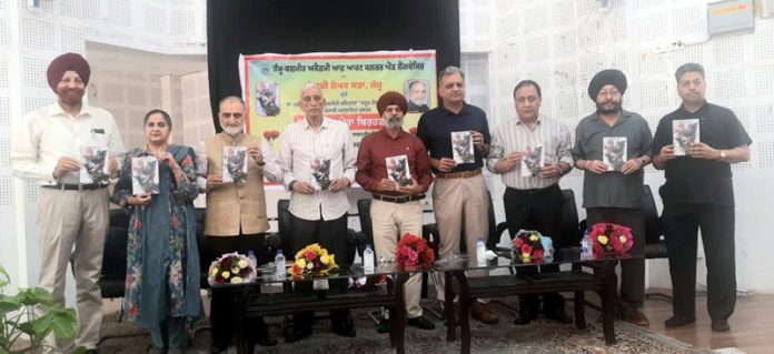Dignitaries releasing a book in Jammu on Saturday.