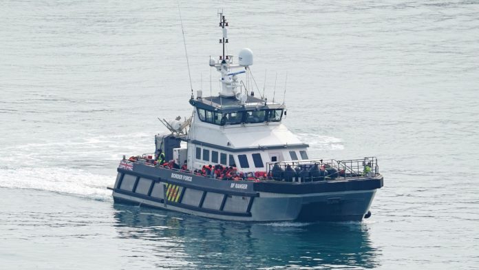 1 person dies when boat overloaded with  migrants sinks in English Channel