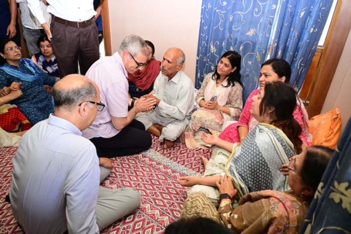 CM Omar Abdullah meeting the family of JKAS officer Dr Raj Kumar Thapa.