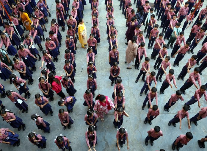 Students attending morning assembly as schools re-open on Thursday. — Excelsior/Rakesh
