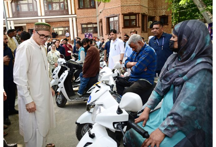 CM Omar Abdullah presenting scooties among specially-abled people in Ganderbal. CM Omar Abdullah presenting scooties among specially-abled people in Ganderbal.