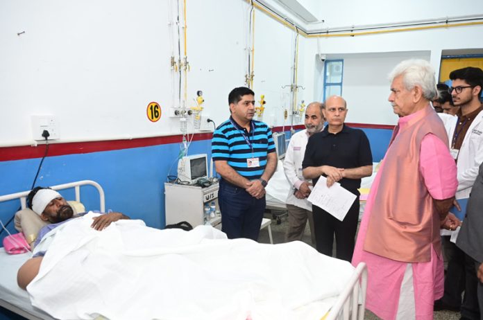 LG Manoj Sinha inquiring condition of Pak shelling victim at GMC Jammu on Sunday. LG Manoj Sinha inquiring condition of Pak shelling victim at GMC Jammu on Sunday.