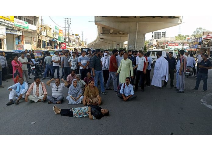 Locals staging a demonstration against bovine and drug smugglers in Samba district on Sunday.