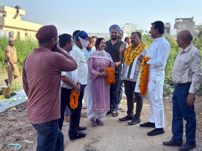 MLA Bahu, Ch Vikram Randhawa interacting with people during tour of Sanjay Nagar on Friday.