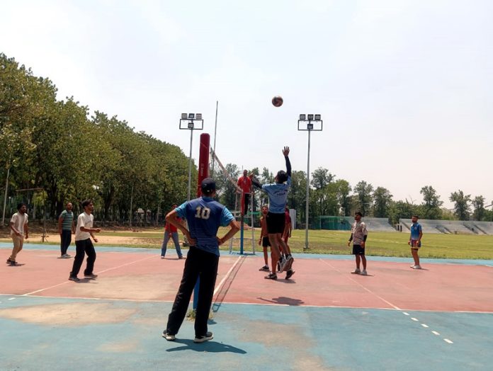 Players in action during a volleyball match at Jammu University. Players in action during a volleyball match at Jammu University.
