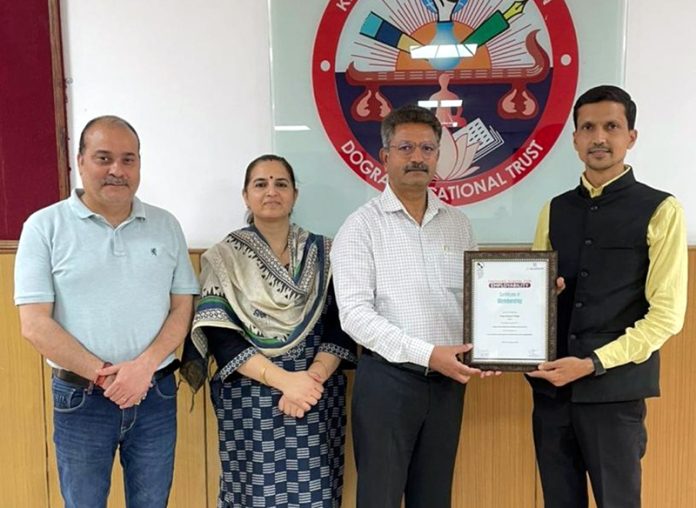 Dr. Samar Dev Singh Charak, Secretary, Dogra Educational Trust receiving award.