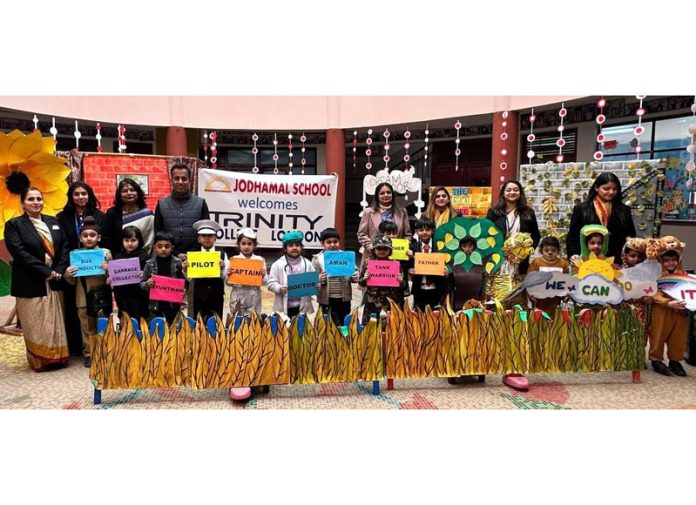 Students posing along with school management.