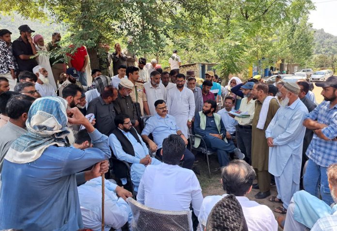 Minister Javed Ahmed Rana interacting with people in Mankote Sector of Poonch on Friday.