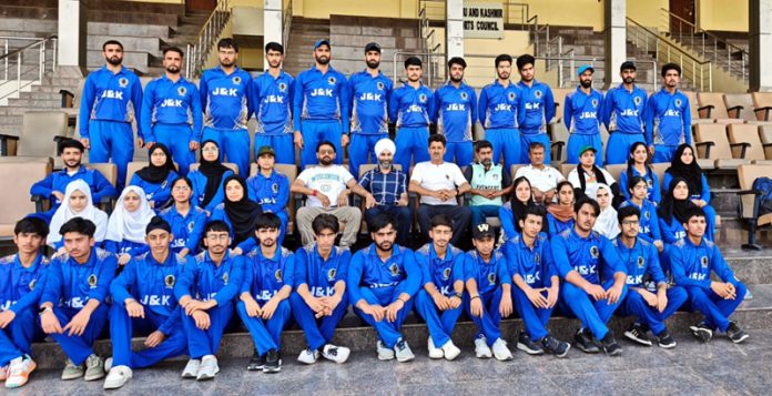 Selected Tennis ball cricket teams of girls and boys posing along with dignitaries.