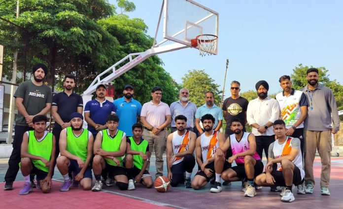 Basketball players posing along with dignitaries. Basketball players posing along with dignitaries.
