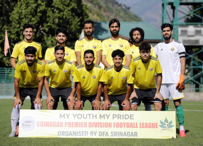 Winning team posing for group photograph.