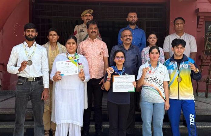 Outstanding sportspersons posing along with management of Cluster University of Jammu during felicitation ceremony.