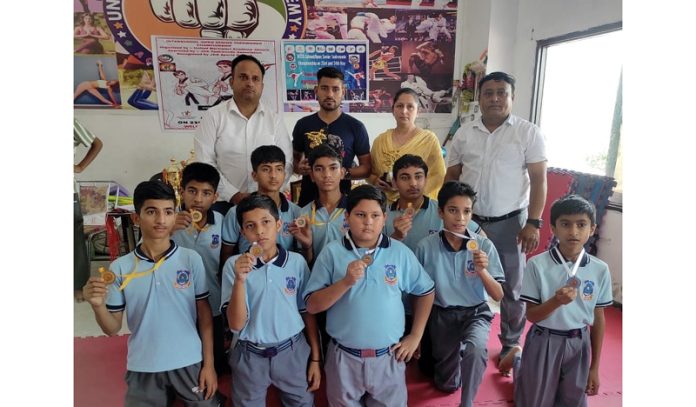 Students of Lawrence School, Sidhra posing along with medals.