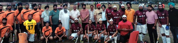 Hockey players posing along with dignitaries. Hockey players posing along with dignitaries.