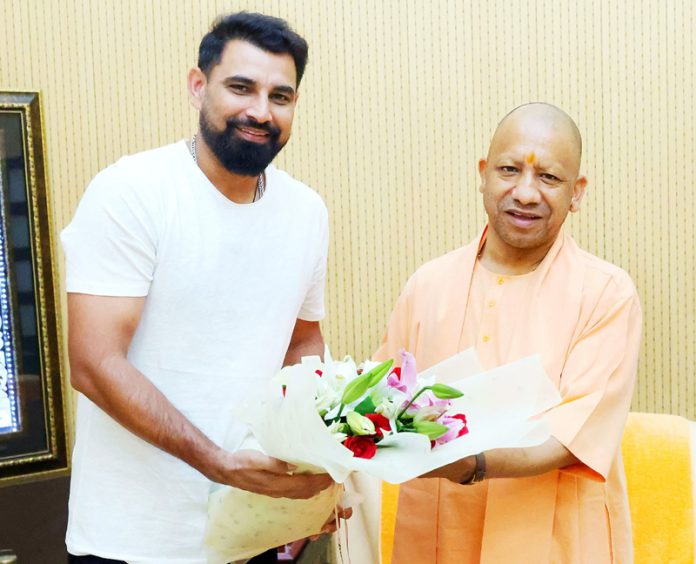 Indian Cricket Team pacer Mohammed Shami called on Uttar Pradesh Chief Minister Yogi Adityanath in Lucknow on Monday. (UNI)