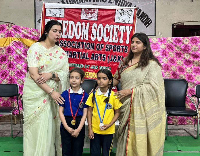 Medal winners posing with Principal and Headmistress of DBN Mubarak Mandi during prize distribution ceremony.